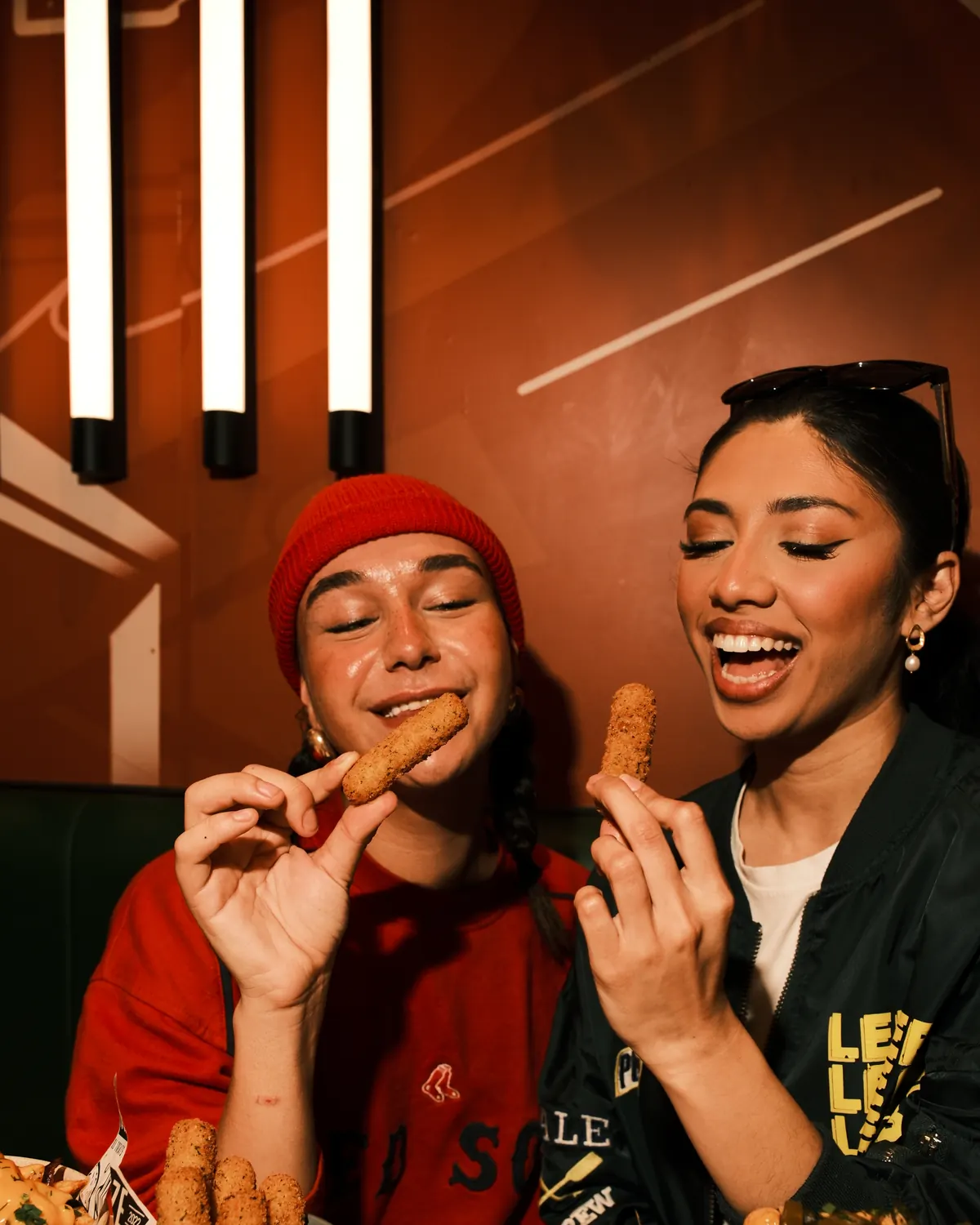 Guests sharing plates in a booth